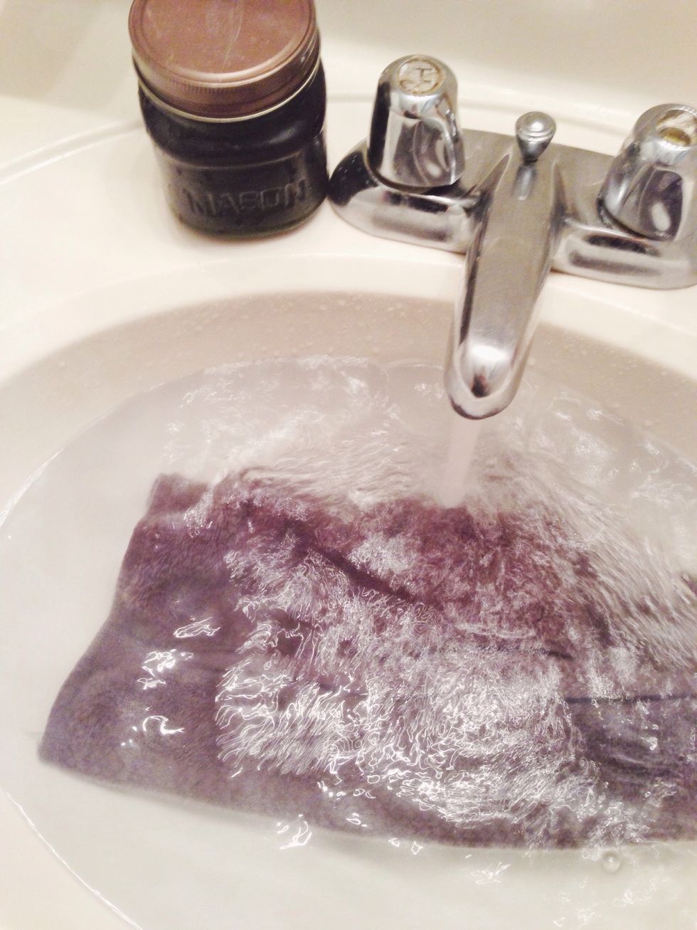 Soak cloth in hot water. As hot as you can stand.