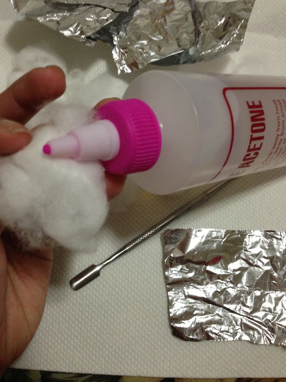 Soak cotton ball with Pure Acetone.
