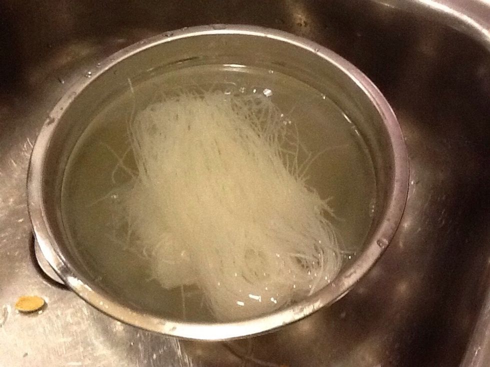 Soak Noodles in hot boiling water for 5-7 minutes until fully hydrated, pour into a colander, splash sesame oil. Toss and Separate.