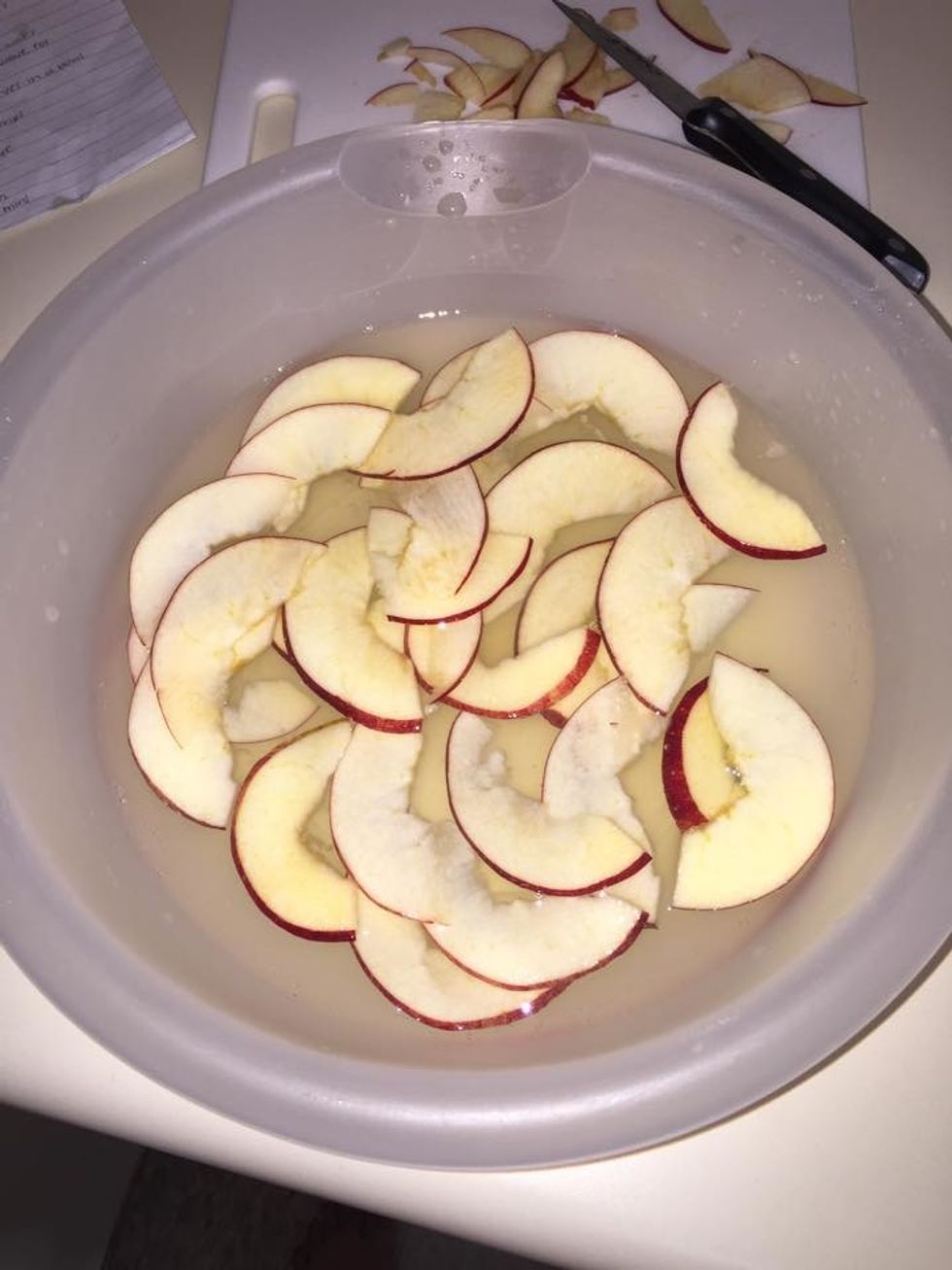 Soak the apple slice into the lemon juice and water and microwave for 3 minutes.