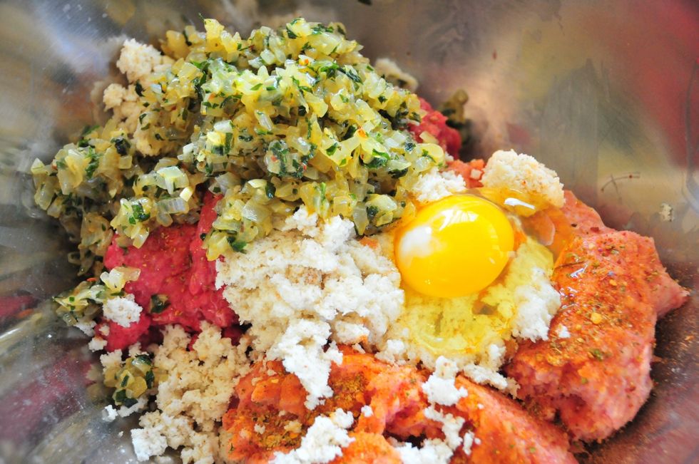 Soak the bread in milk for about 15 minutes. Remove from milk and squeeze out as much milk as possible. Let the onions cool.  Mix meat, egg, onions, bread, Parmesan and 2 tsp. #4 Pronto Italiano.