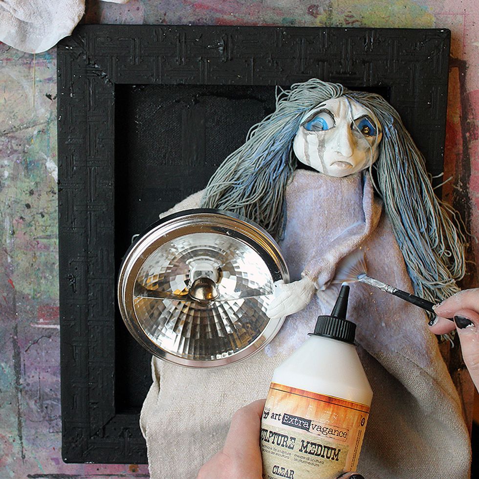 Soak the fabric with the Clear Sculpture Medium. Use a brush to push the medium into the fibers. Let dry a bit and arrange all the pleats as you wish. Let the medium dry over night.