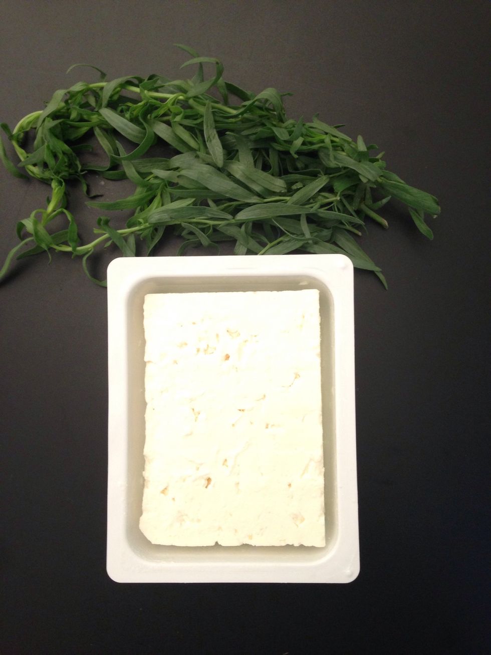 Soak the feta cheese in cold water to remove excess salt. Change the water 2-3 times every 1/2 hr. This really depends on how much salty the feta you are using. Mince the tarragon.
