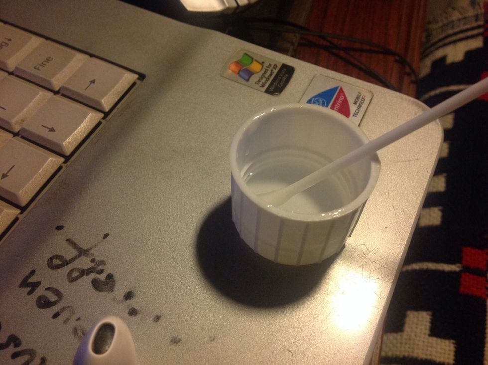 Soak the Q-tip into the hydrogen peroxide solution.