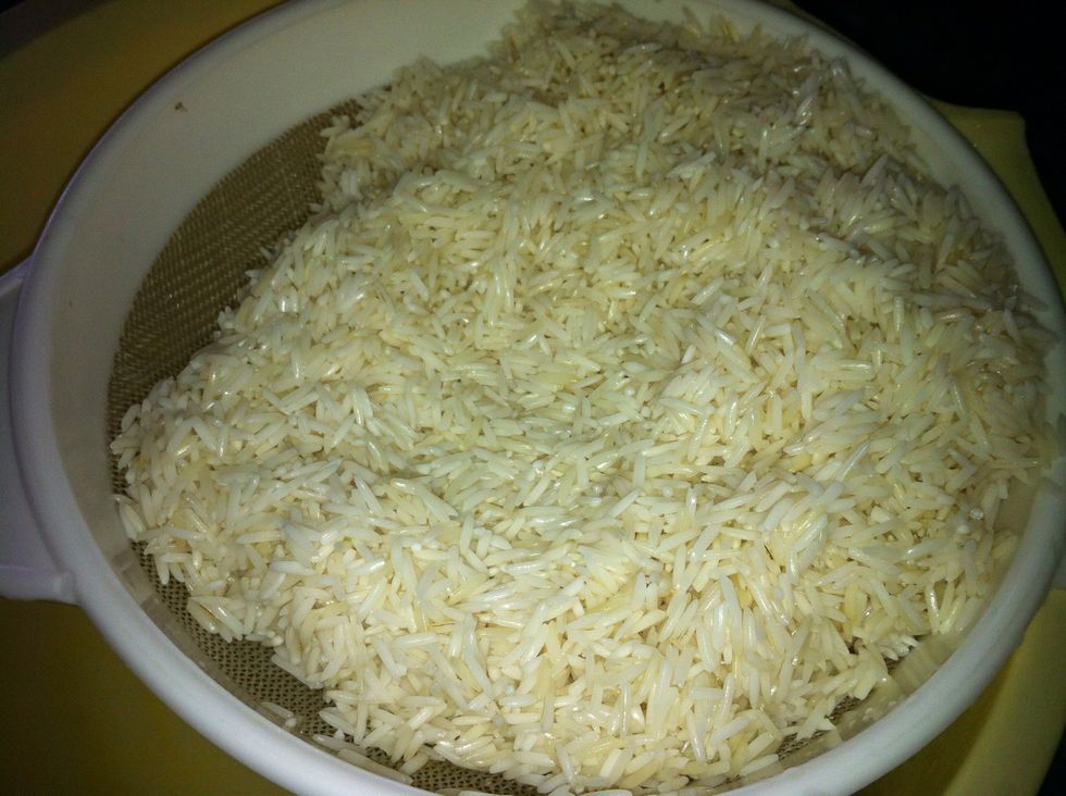 Soak the rice at least for 5 hours.Wash the rice twice.The soaked rice makes it easier to grind. If you are using an electric grinder you may keep the water. If using a mortar & pestle, drain the rice
