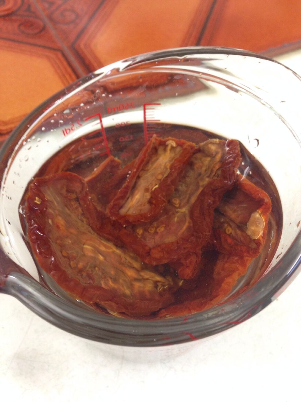 Soak the sun-dried tomatoes in some water to rehydrate them