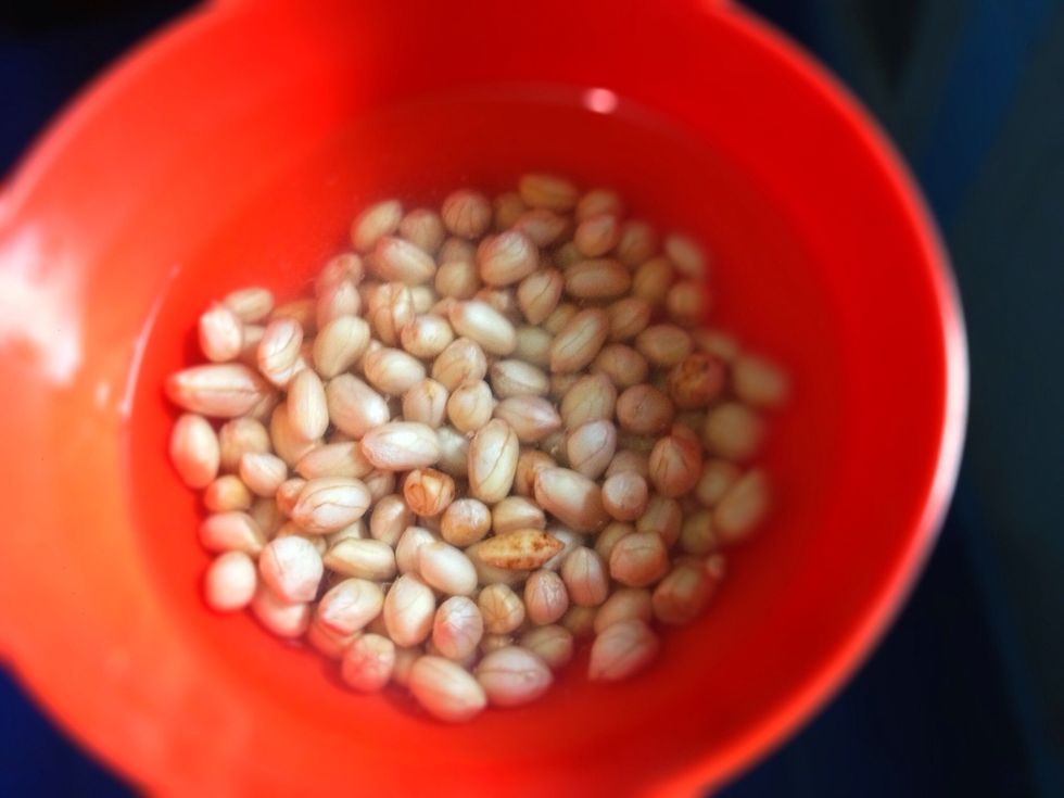 Soak your peanuts in salted water for 30 mnts to over nite. Wash and drain the salted water once it is redy to be added to the soup