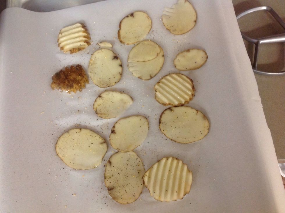 Soak your potatoes in cold water to remove the starch. Then lay on a single layer on a piece of parchment paper. Drizzle with olive oil and seasonings.