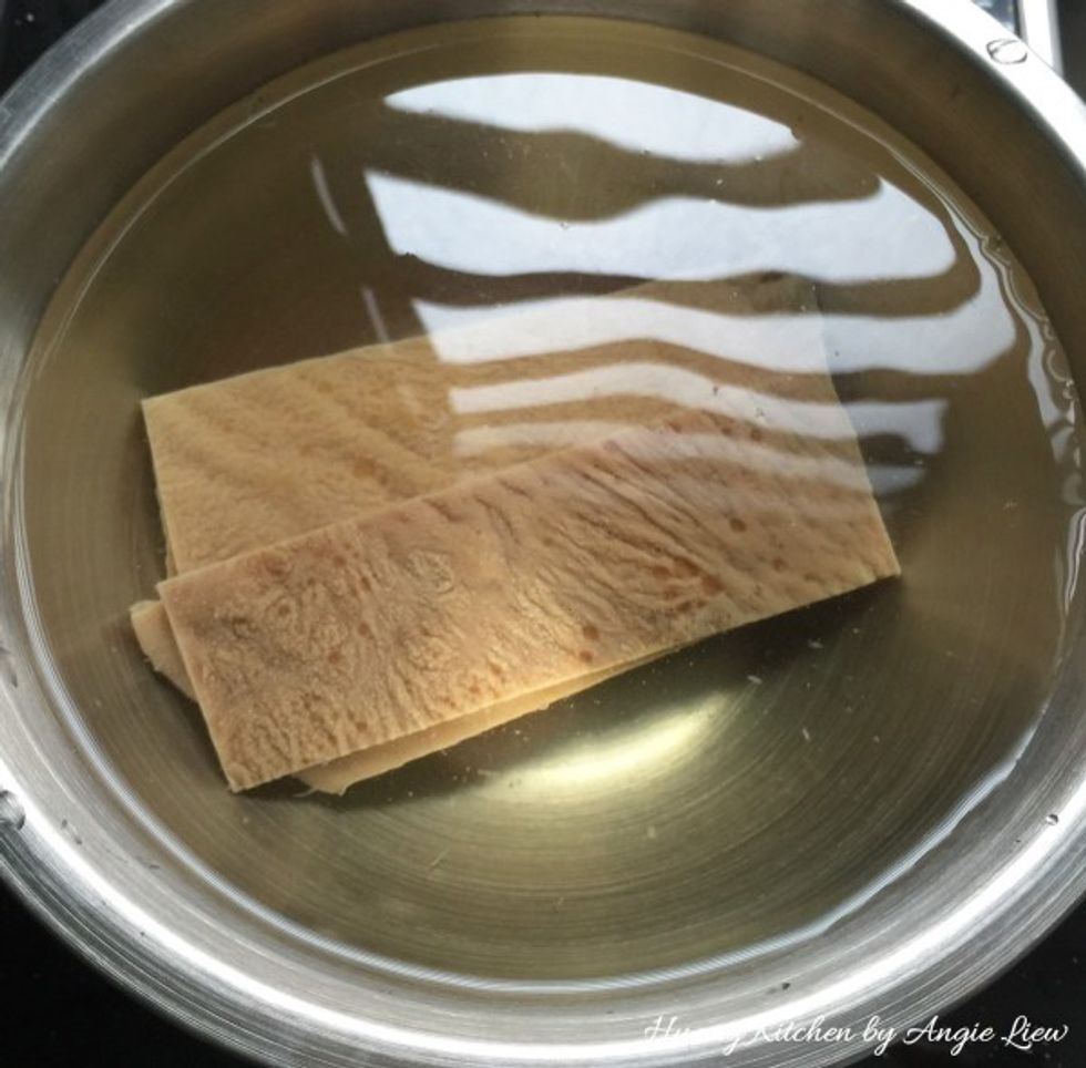Soaked the dried sweet bean curd sheets in water, until slightly soft.