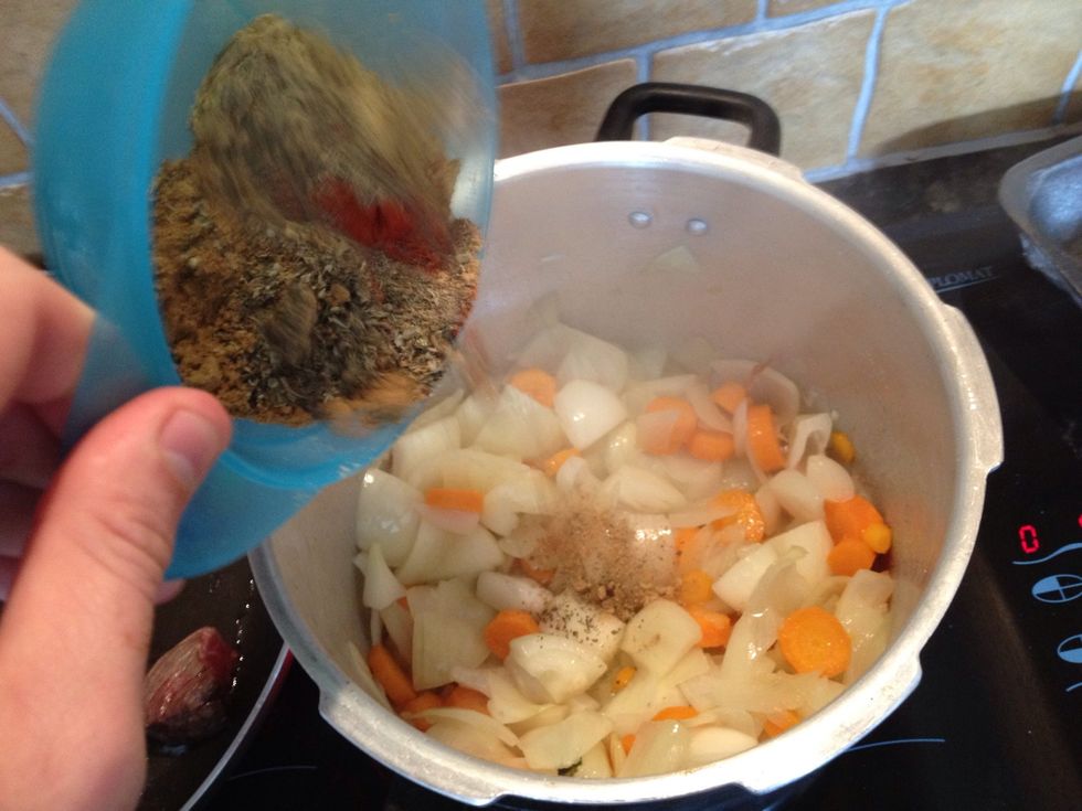 SOFTEN onions carrots & garlic and add spices.It WILL go dry here but this will develop flavour AT THIS POINT ADD TOMATOES, BEANS AND WATER. Pressure cook for 20 minutes and add potatoes for 10 mins