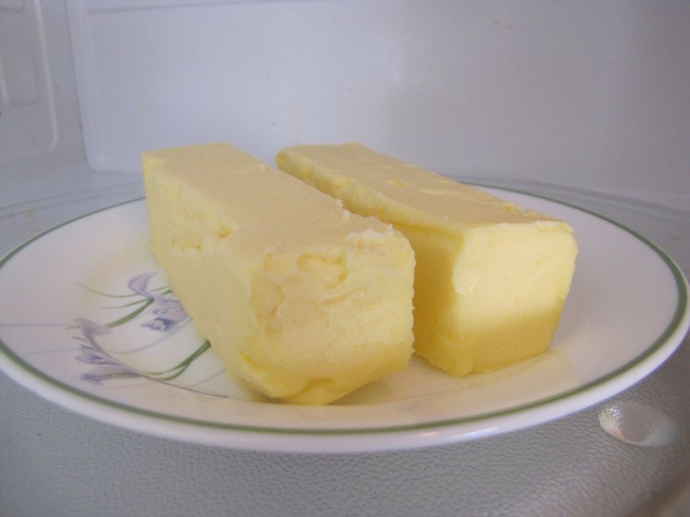 Soften the 2 sticks of margarine by microwaving them for 20 seconds.