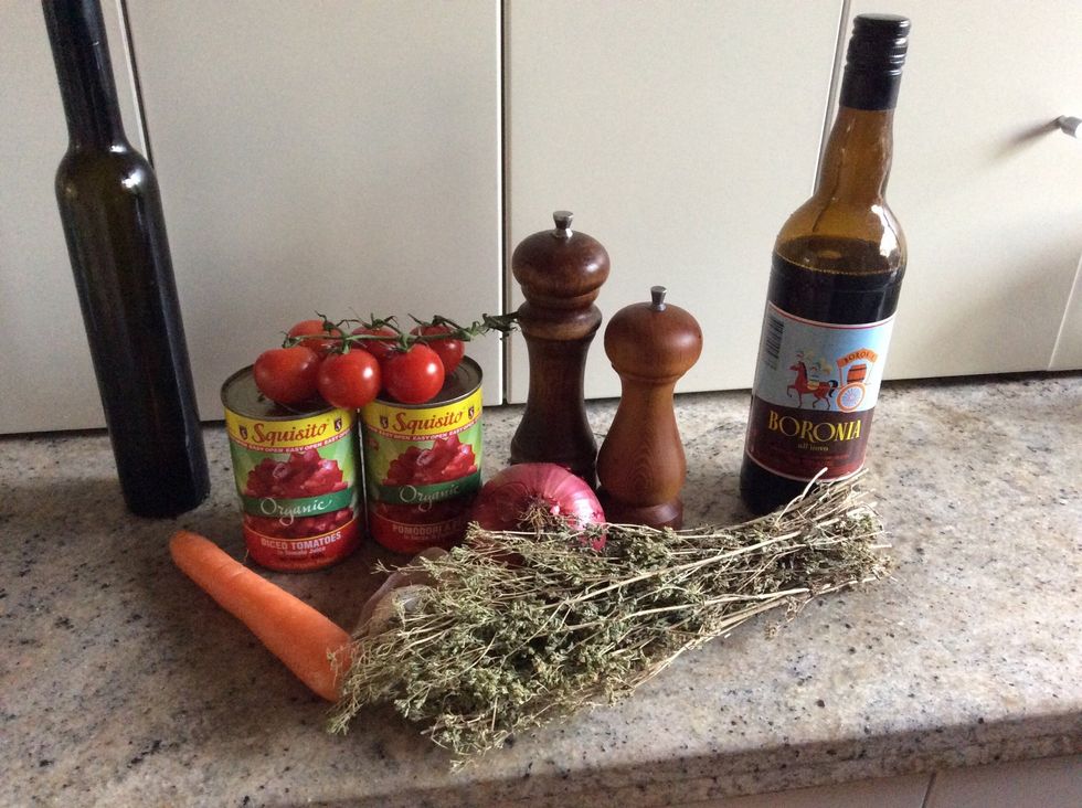 Soften the garlic and onion in the olive oil add carrots tomatoes and wine break down the tomatoes with a wooden spoon. In a pot raise the heat and cook hard for 15 minuets. Then Sprinkle on oregano.