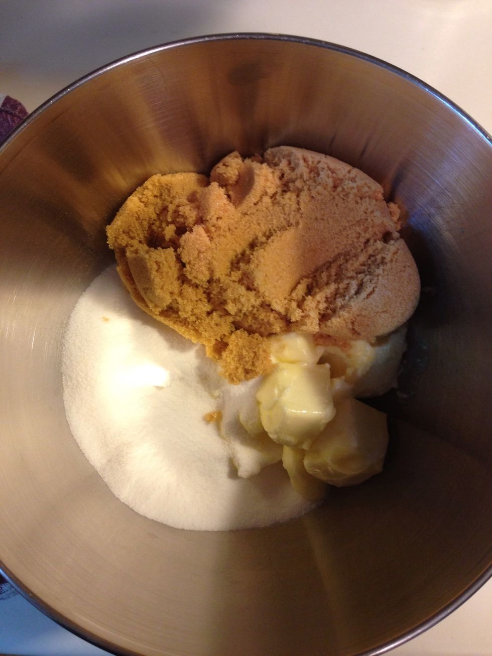 Soften your butter in the microwave for about a minute on half-power. Then add it and your sugars together in a mixer. If you don't have a KitchenAid, start saving your pennies. These things rock!