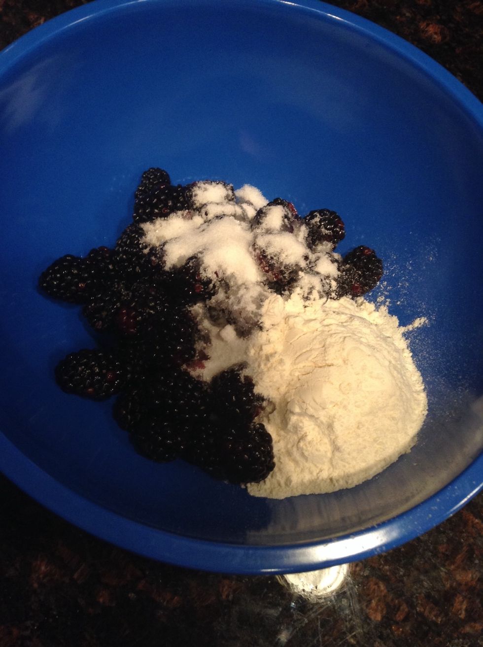 Softly, combine 3 and a half cups of blackberries with flour and sugar