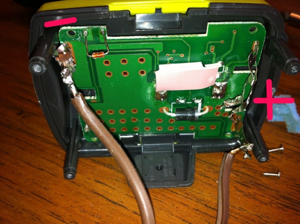 Solder the correct wires to the correct polarity connections left from the removed battery cells.