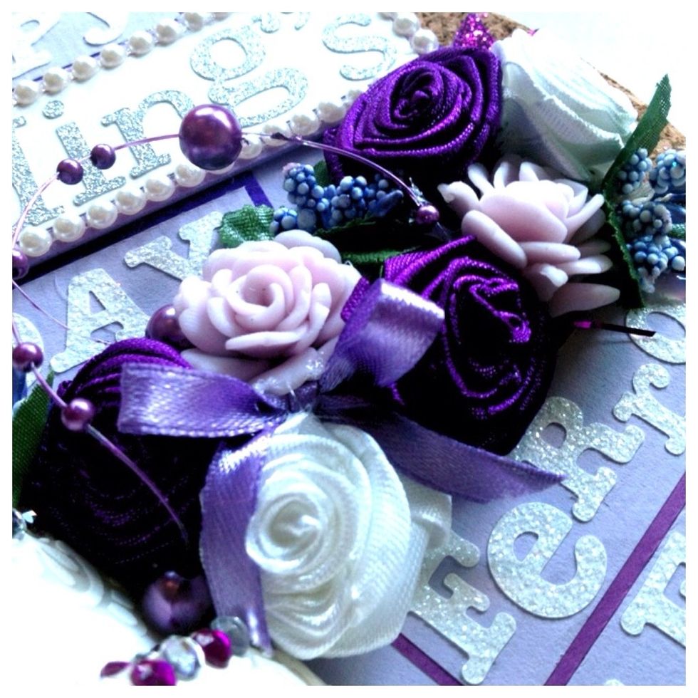 Some handmade ribbon roses, clay roses, etc.. I used glue gun to stick em all.