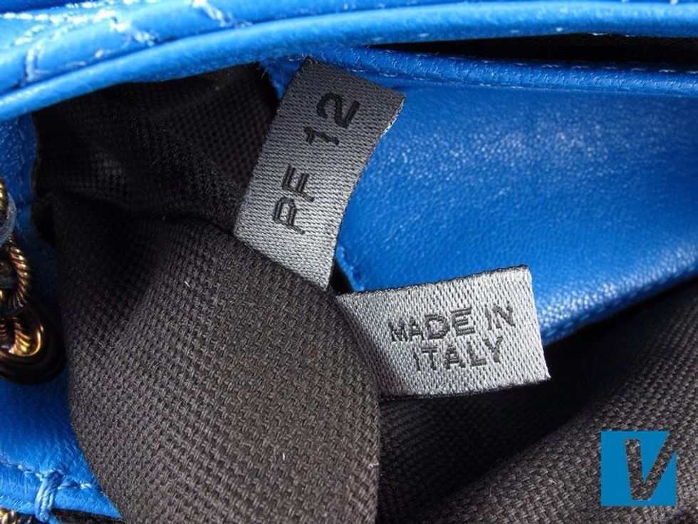 Some new Marc Jacobs handbags feature a tag with 'Made in' and the season code detailed located on the bottom side of the interior pocket.