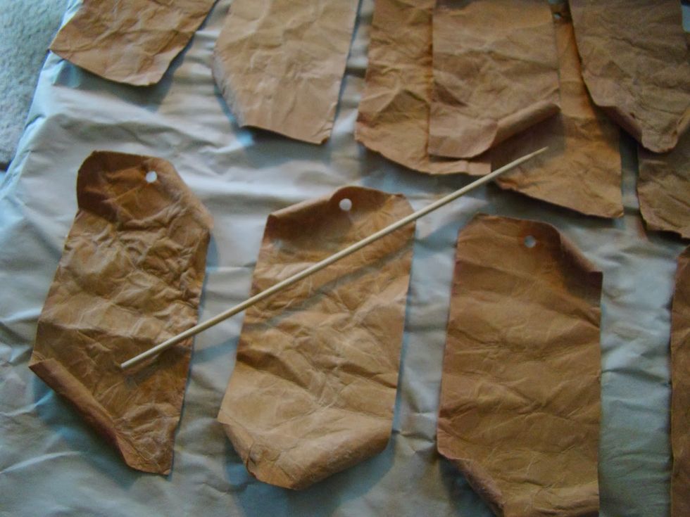 Some of the corners I will curl to give just a bit more vintage look...  you must do this step when the tags are still damp otherwise it won't hold the shape. I use a skewer or pencil for this.