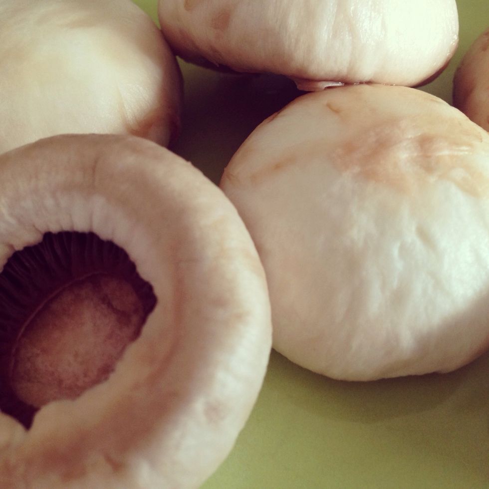 Some people are weird about washing their mushrooms, but since we're going to use them right away, I say do it. I also say don't worry about it if the skin comes off. I know ppl who do that on purpose