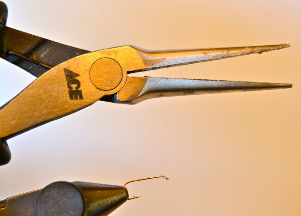 Some regulations require the use of barbless hooks. If you have a barbed hook, simply squeeze the barb flat with a pair of needle nose pliers. (I personally de-barb all my hooks.)