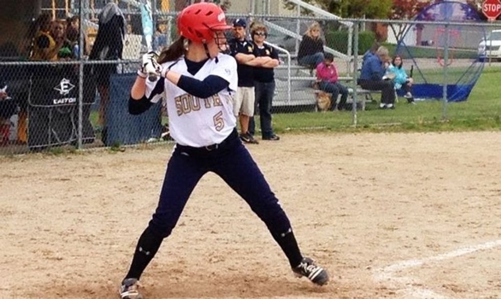 Someone is up to bat, and watching the ball the entire time.