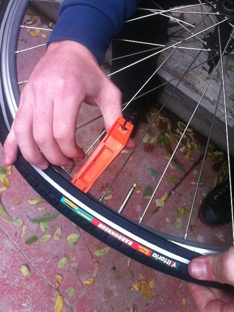 sometime tires can be tough. I use a tire lever to pop in the last bit.