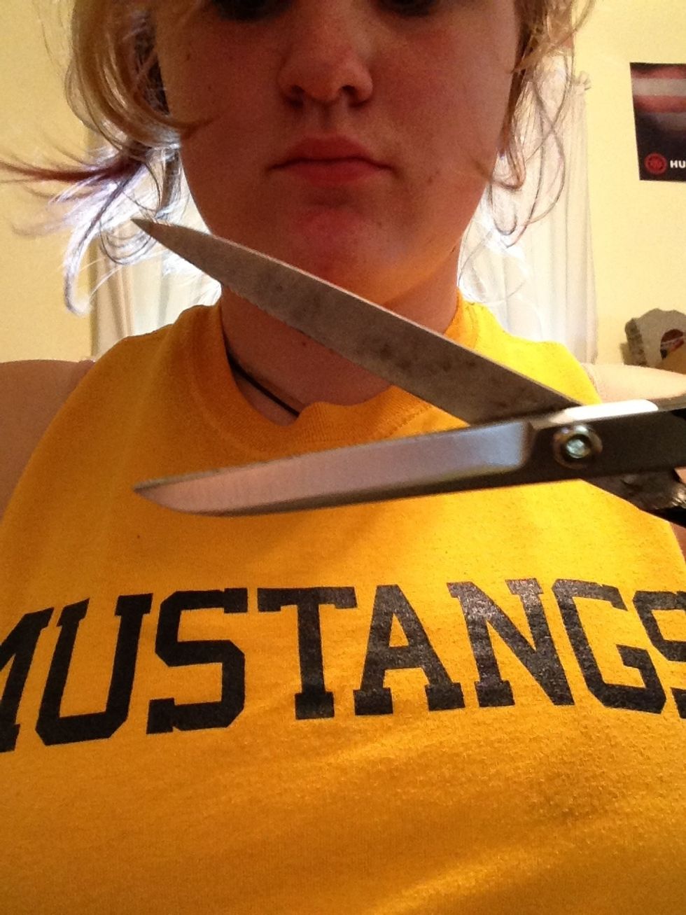 Soo take your scissors with the shirt on