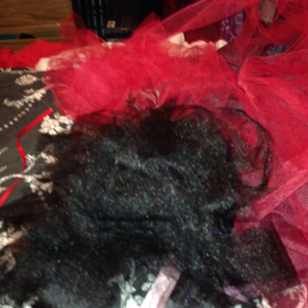 Sorry about the blurry photo but this is the piles of both colored tulle. Just enough to get me started... Where oh where could my helper be... Ohh panda bear where are you??