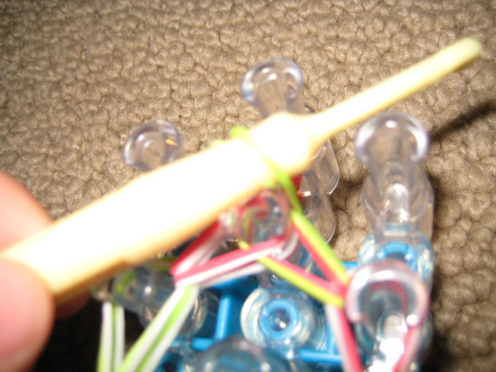 (Sorry, blurry!)  Bring band onto hook.