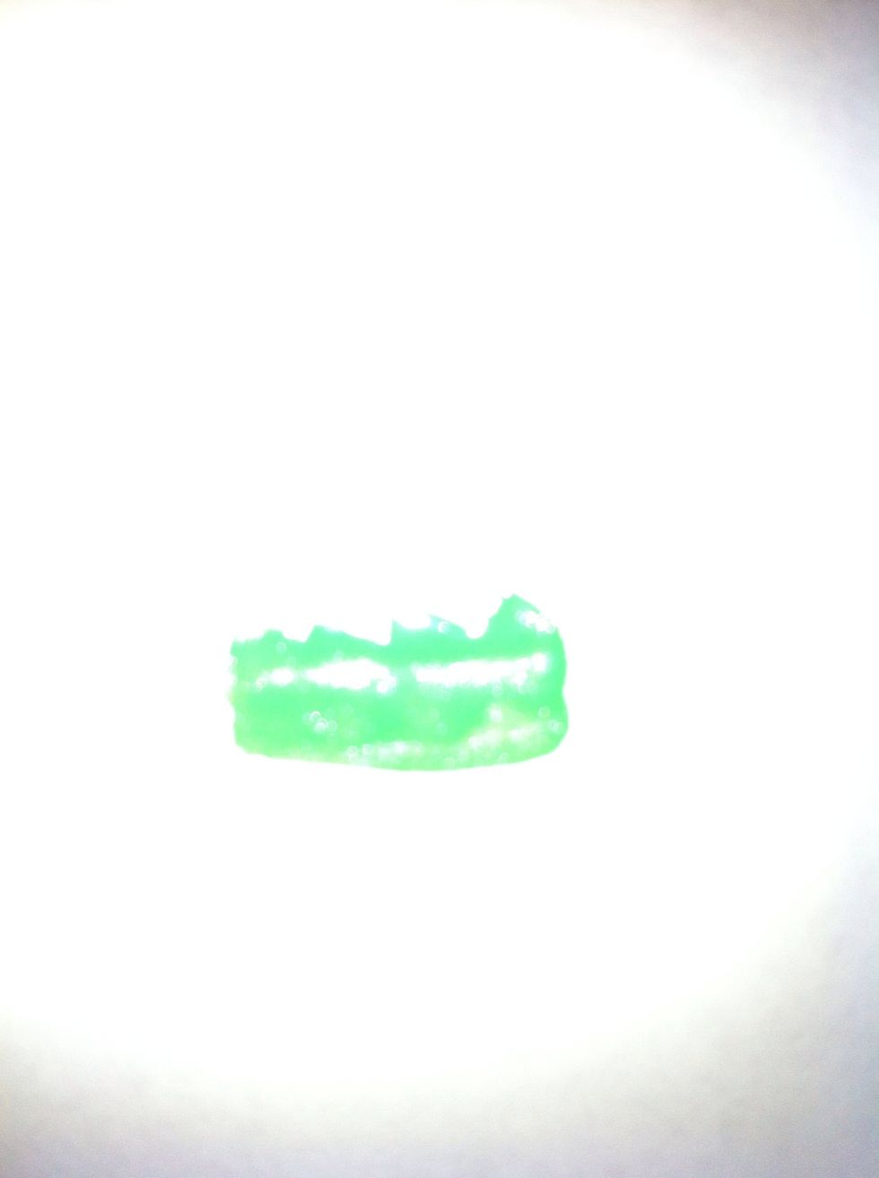 Sorry for the bad quality. Take the green polish brush and create a grass effect on the nail, similar to this.