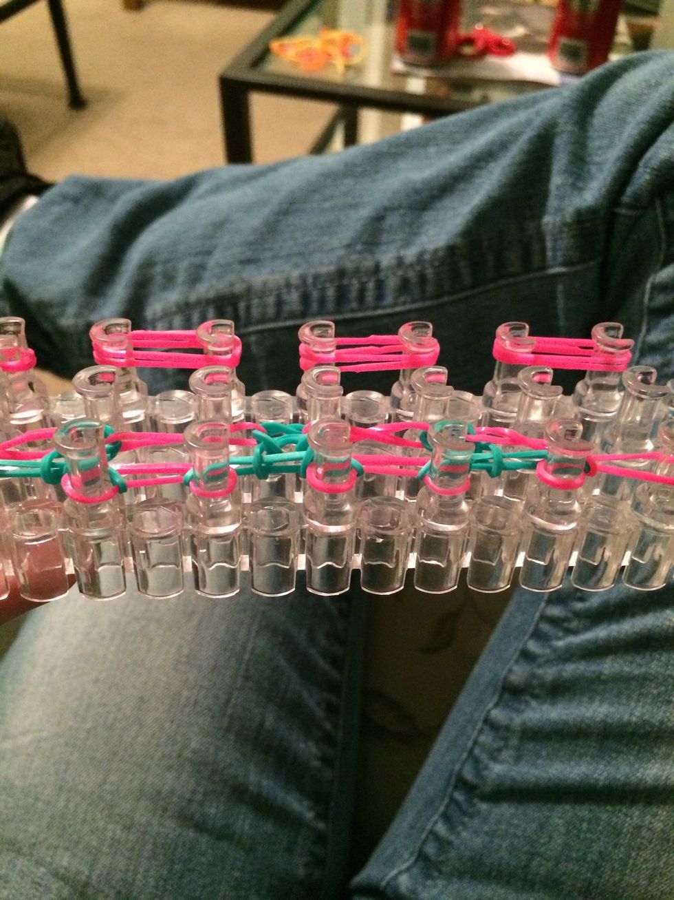 Sorry for the far away pictures, but I want you to see most of the pins. Go ahead and place your next set of 4 pink bands right on top of where you placed the last 4.