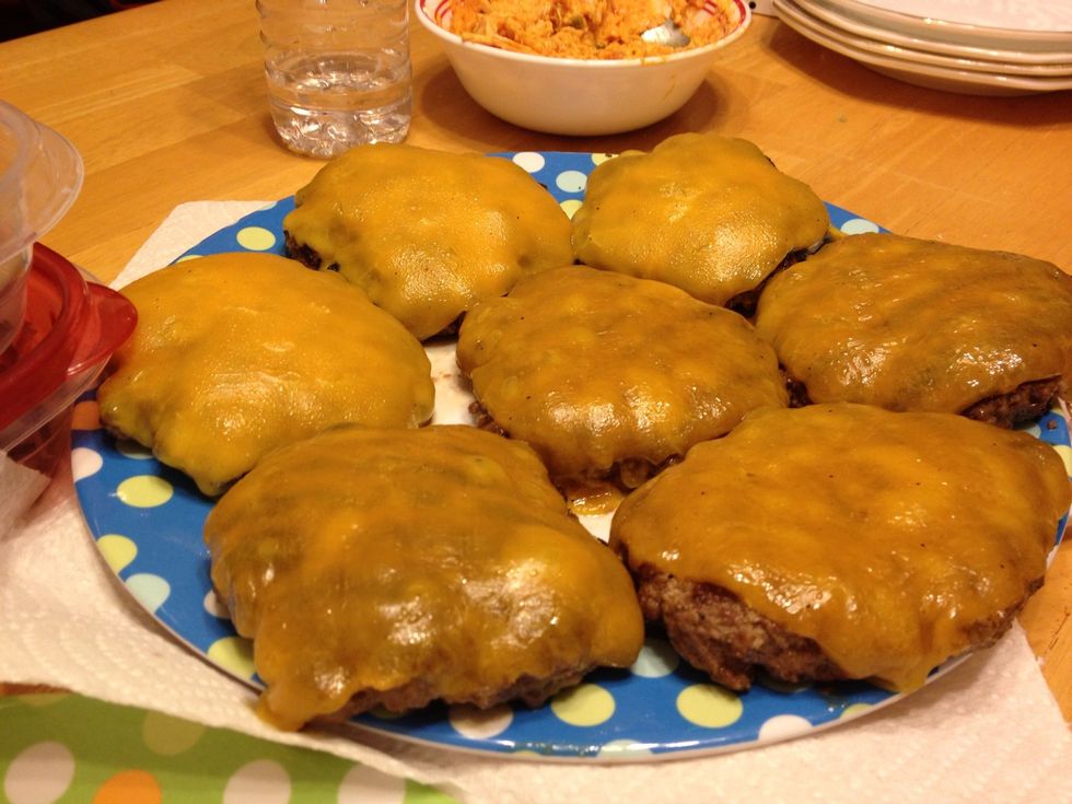 Sorry forgot to take a pic of the burgers cooking, they smelled great! Tada! We added cheese right before they were done and covered them with a frying pan lid to melt the cheese.