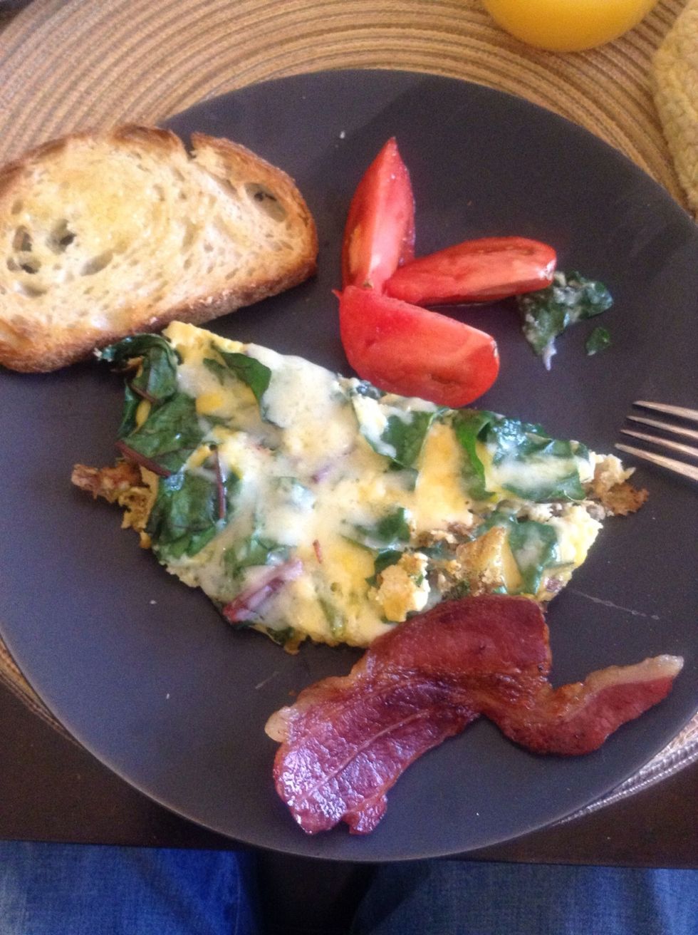 Sourdough bread, tomato, and the egg dish looks and tastes wonderful.