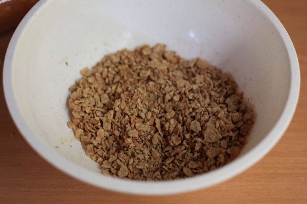 Special K or corn flakes. It's entirely up to you. I like Special K for its thicker flake. Using your hand, crush them to resemble bread crumbs.