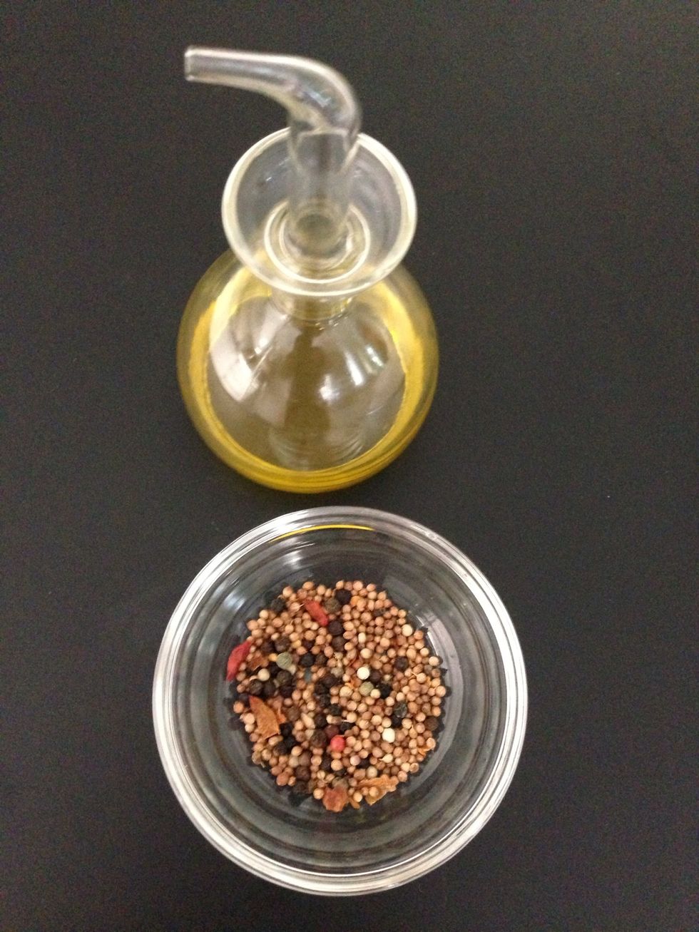 Spices. In a small pot put the oil ( that you will discard later) and the spices. Heat on high until you hear cracking of the seeds. Discard the oil with a strainer and add the seeds over the mangos