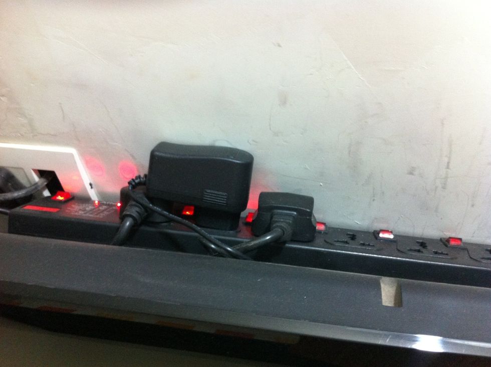 Spike buster box or power extension box hidden behind the TV