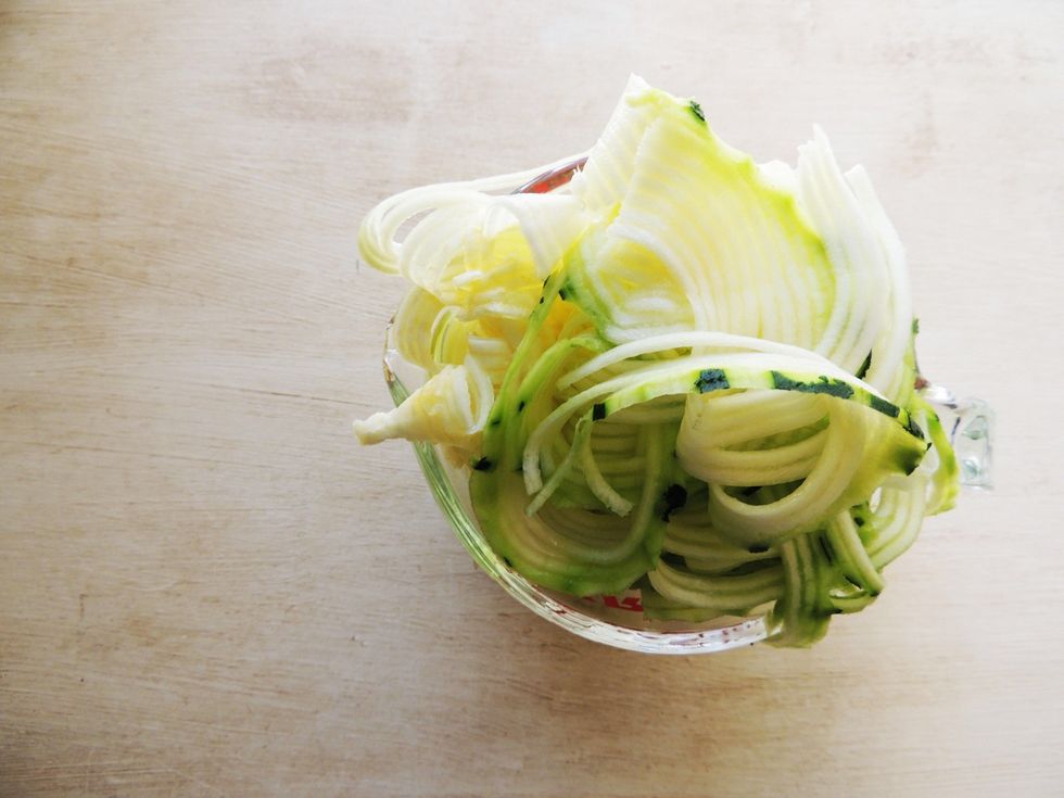 Spiraling the zucchini is easy and fun! Walmart has a gadget for $3 that resembles a pencil sharpener.  Tip: when you get close to the end of the zucchini, stick a fork in it and keep going.