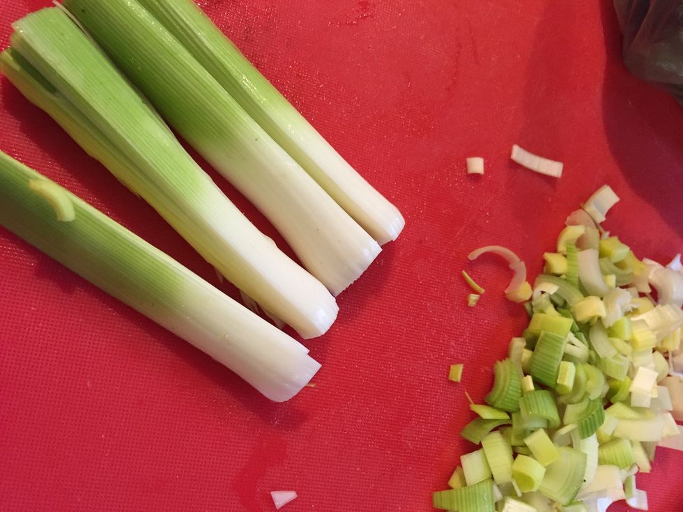 Split clean and quarter lengthwise leeks saut\u00e9 in out for 3 minutes then push leeks out to side of pot forming ring. Add roast, vegetables, herbs and broth to pot.