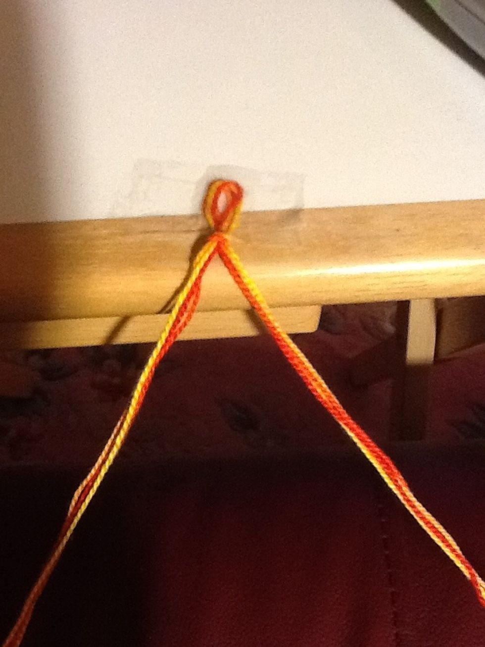 Split in half with one of each color on one side and same for the other.