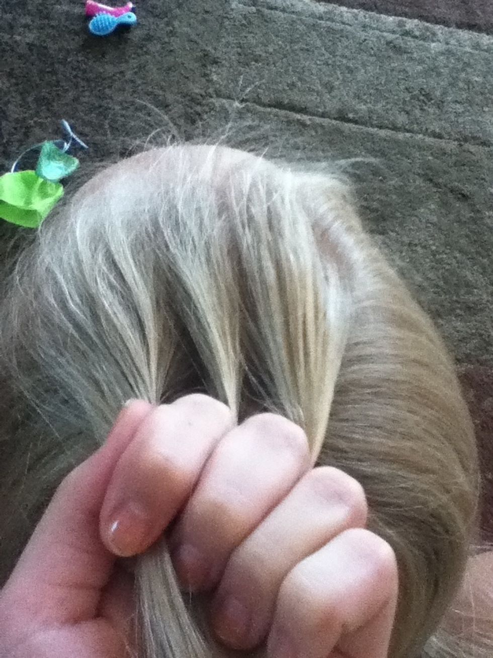 Split that hair into three pieces like a regular braid.