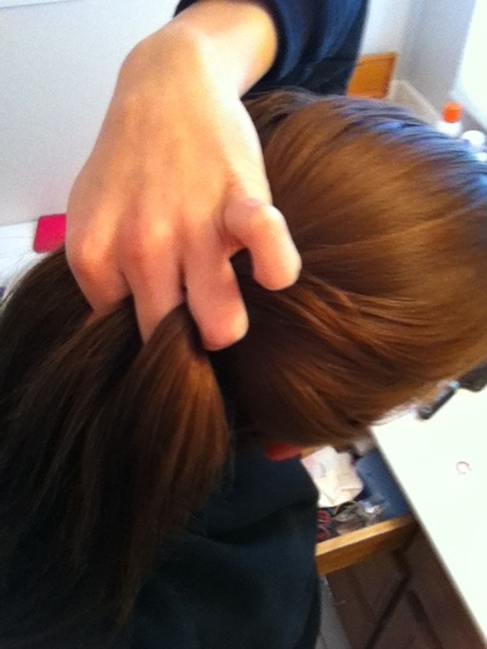 Split the top part of you hair into 3 sections