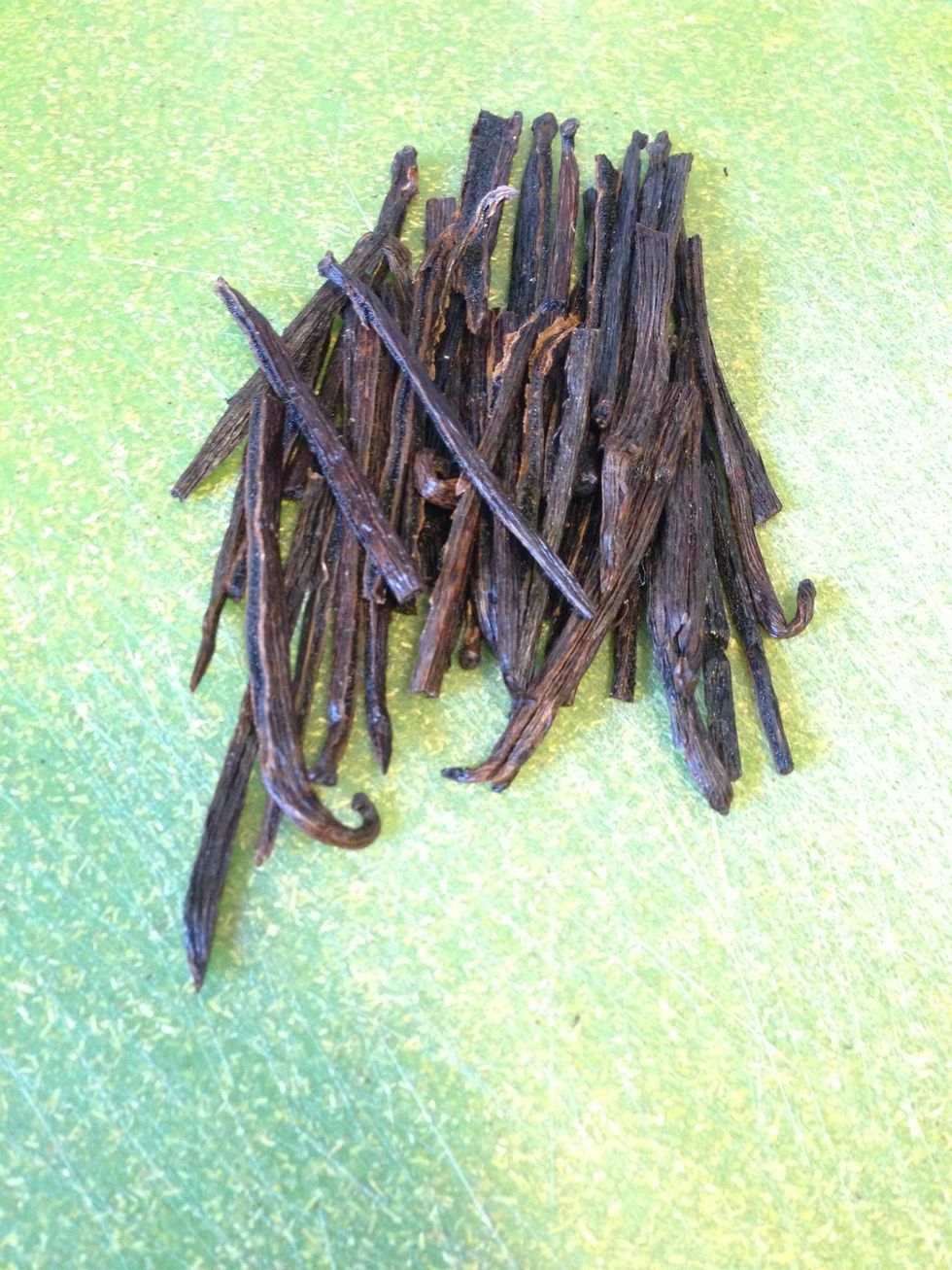 Split the vanilla beans lengthwise and cut them to fit in your containers, if necessary.