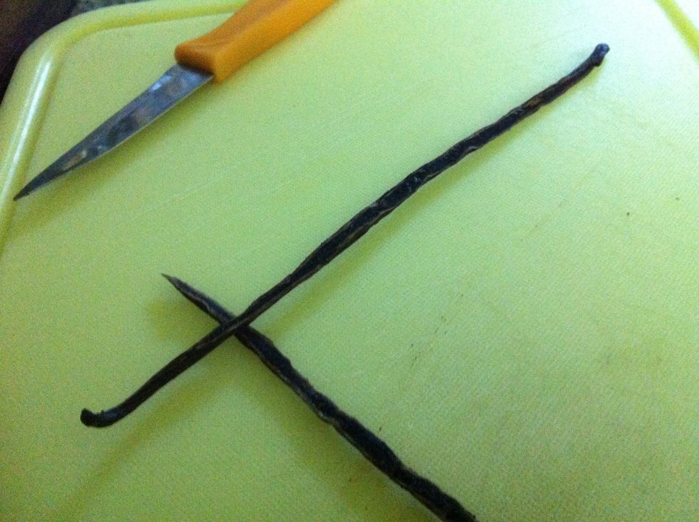 Split the vanilla pod in half, lengthwise. A paring knife will do the job really well.