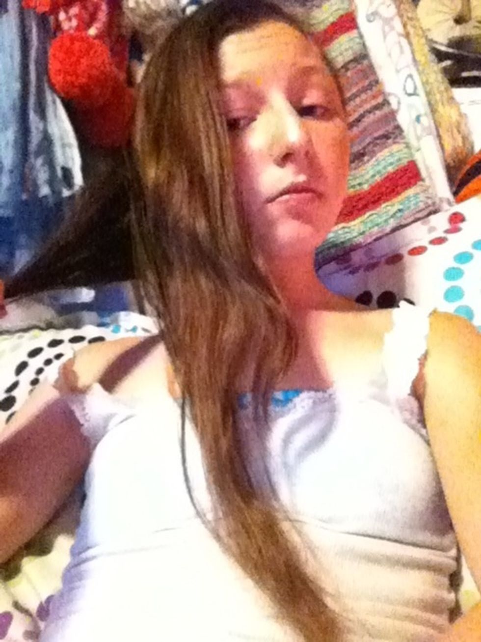 Split your hair into 2 pieces. One in the front and one in the back.