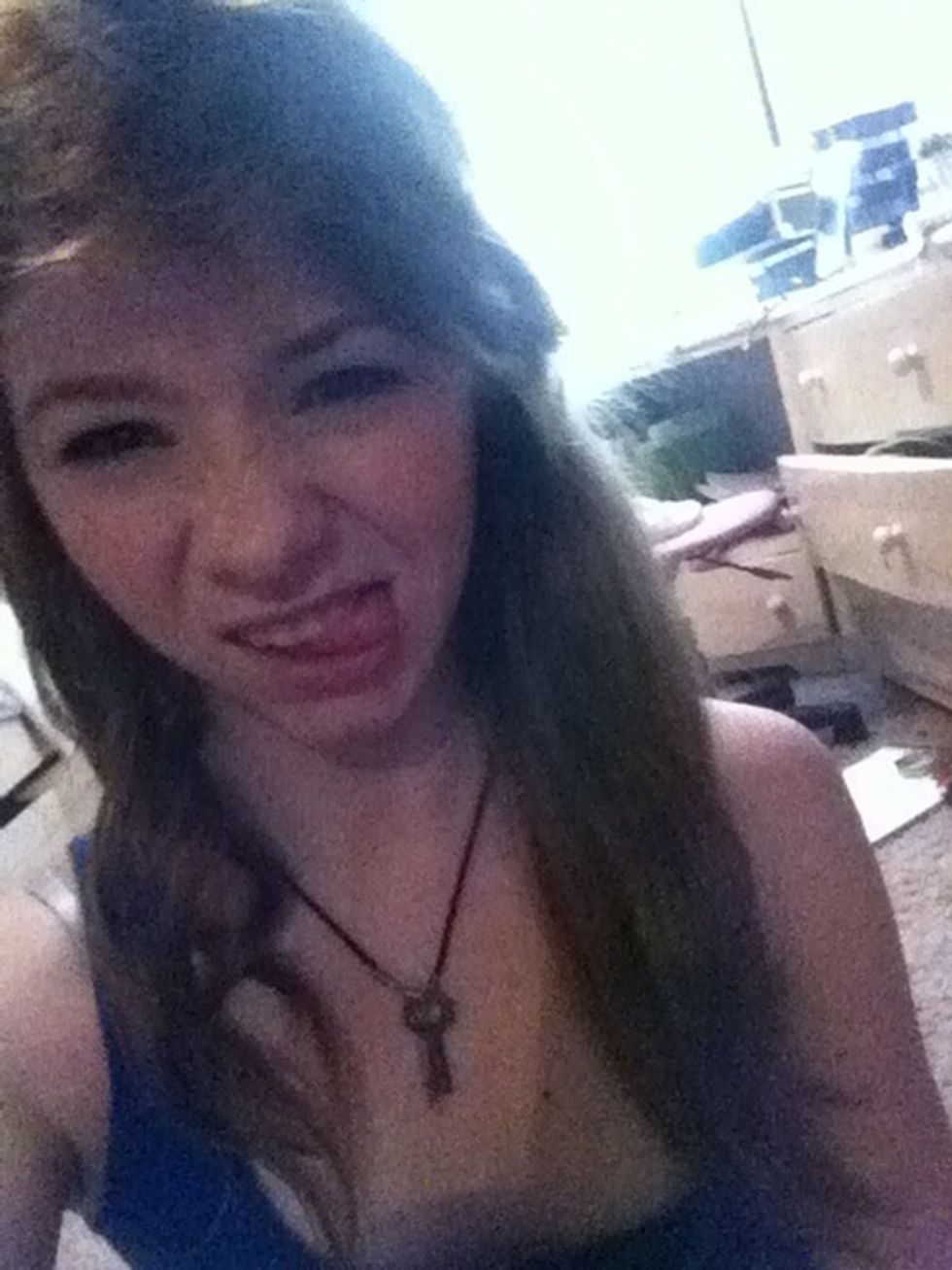 Split your hair into two sections horizontally, clipping the top section out of the way, then split the remaining hair in two again. Brush out any knots and apply heat protectant (: