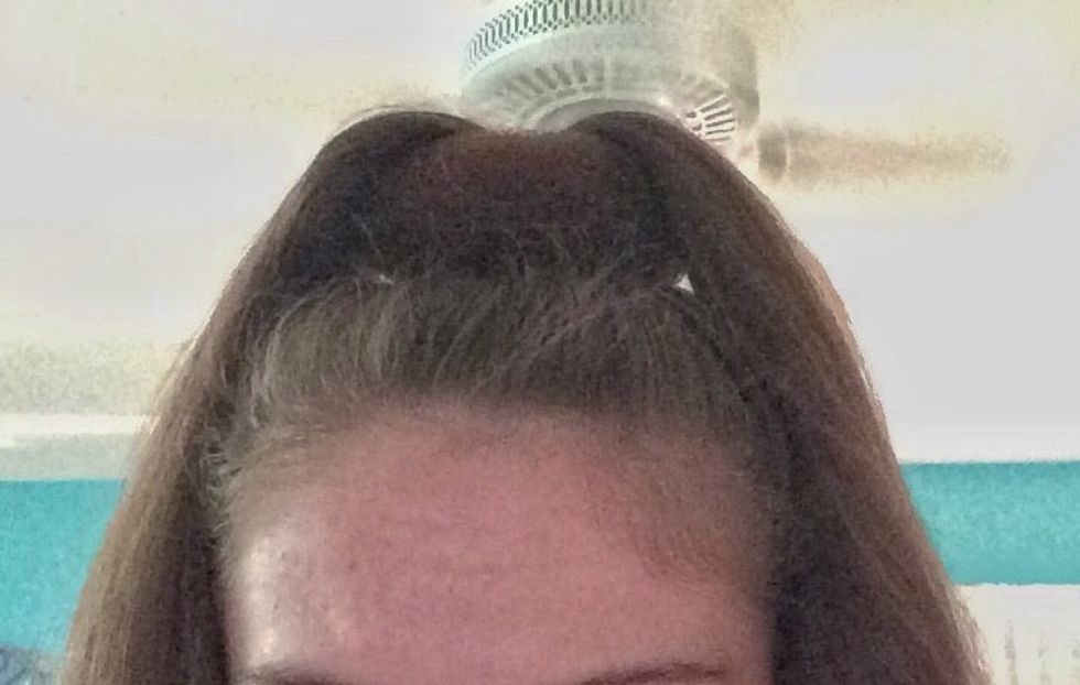 Split your pony tail into two parts.