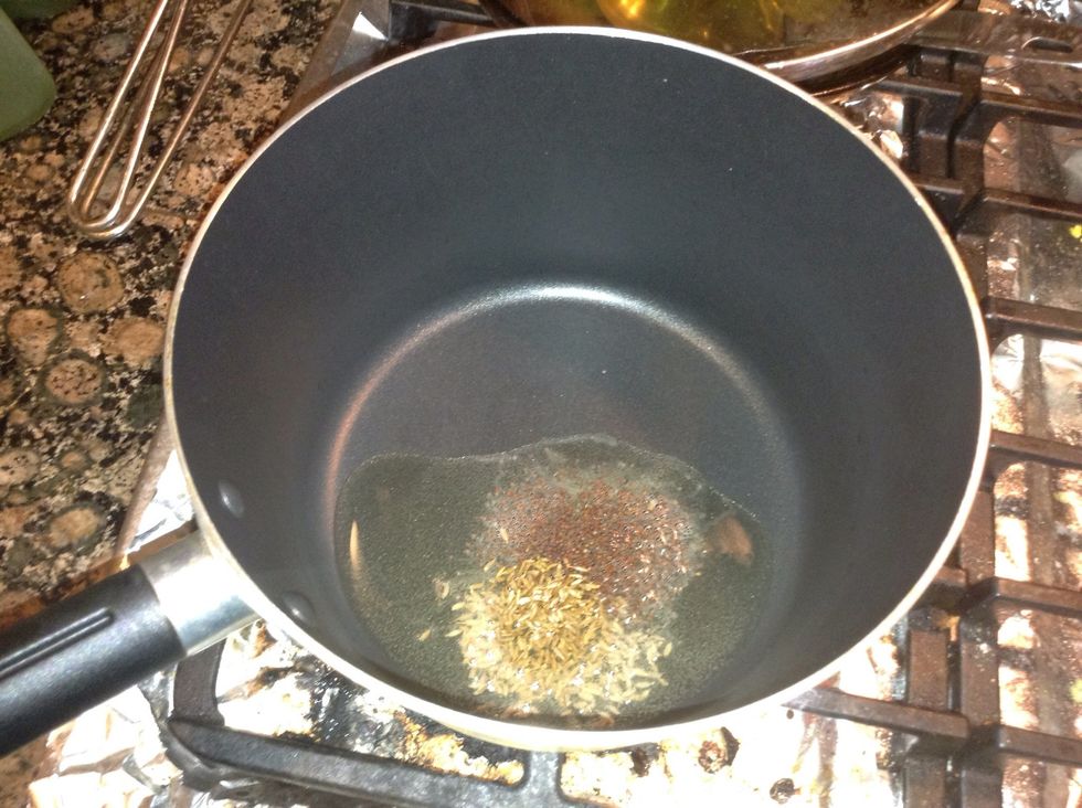 Splitter in some oil the mustard seeds and cumin seeds, add the green garlic pods nicely diced .