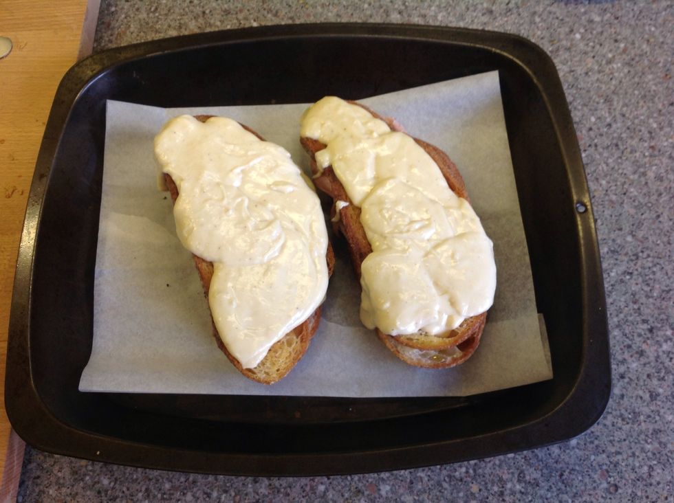 Splodge on the very tasty cheese sauce