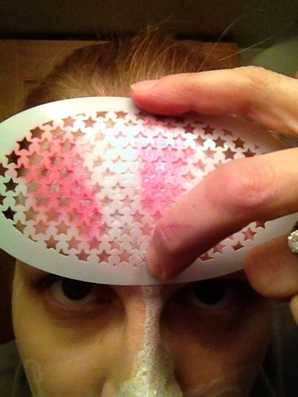 Sponge on some red stars. I tried to do it in a burst pattern, leaving spots for blue stars.