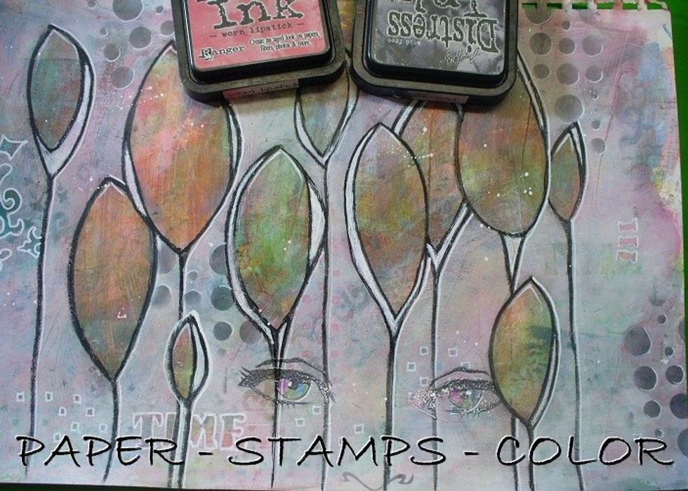 Sponge over the Bubbles stencil as shown with Black Soot Distress ink. Accentueate them with a white acrylic marker.